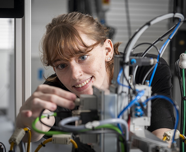 Woman working on technology.