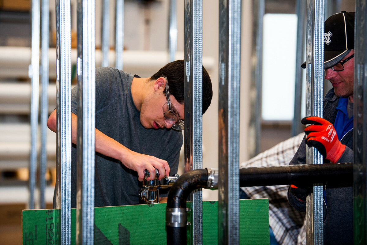 Students working on a plumbing system