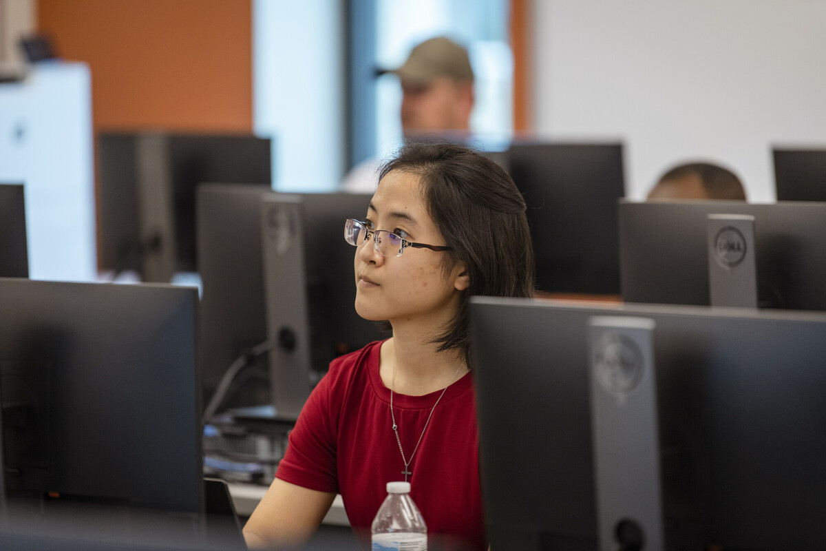 Students listening to lecture inside computer lab