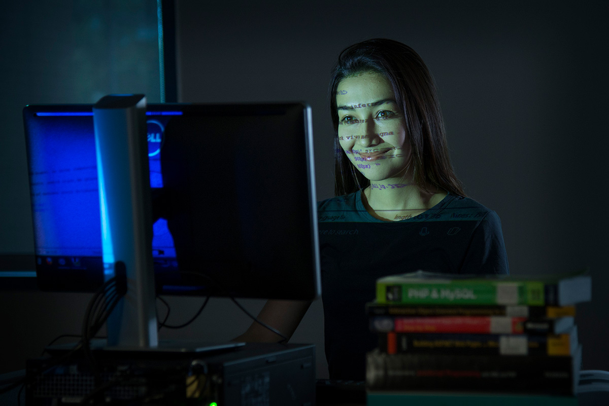 Female student studying in the computer lab