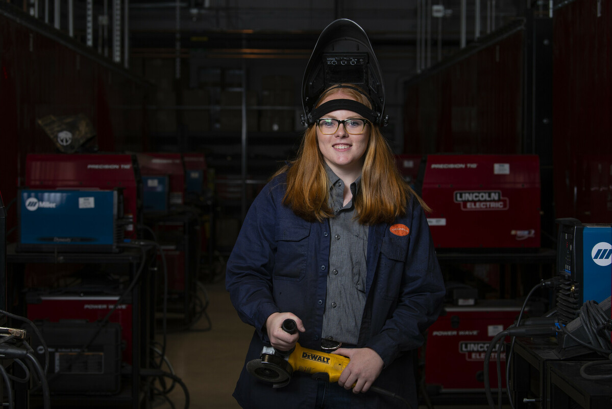 Student working on her welding project
