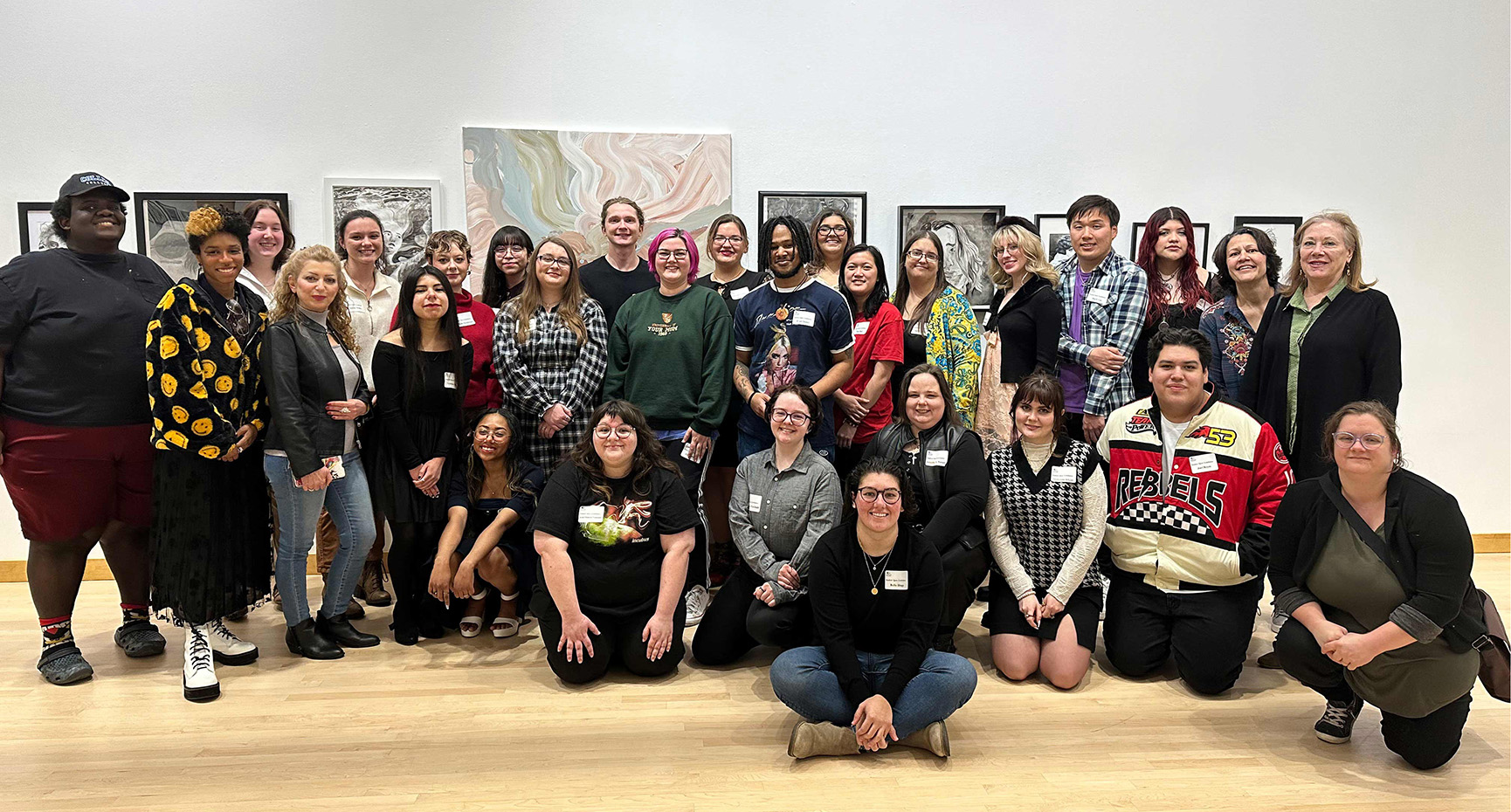 Student artists pose for a photo at the 2023 Student Open art exhibition.