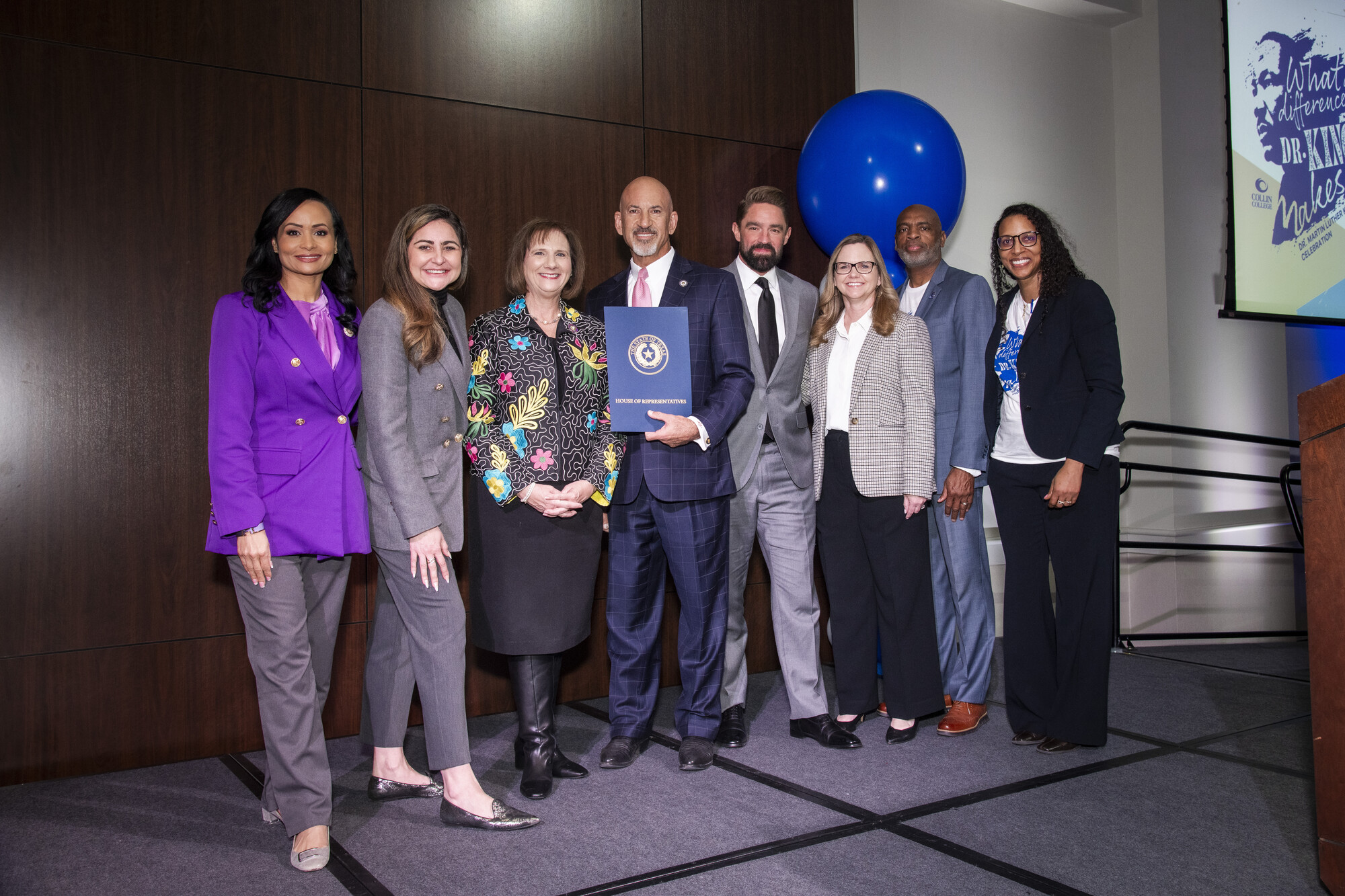 multiple elected officials on stage 