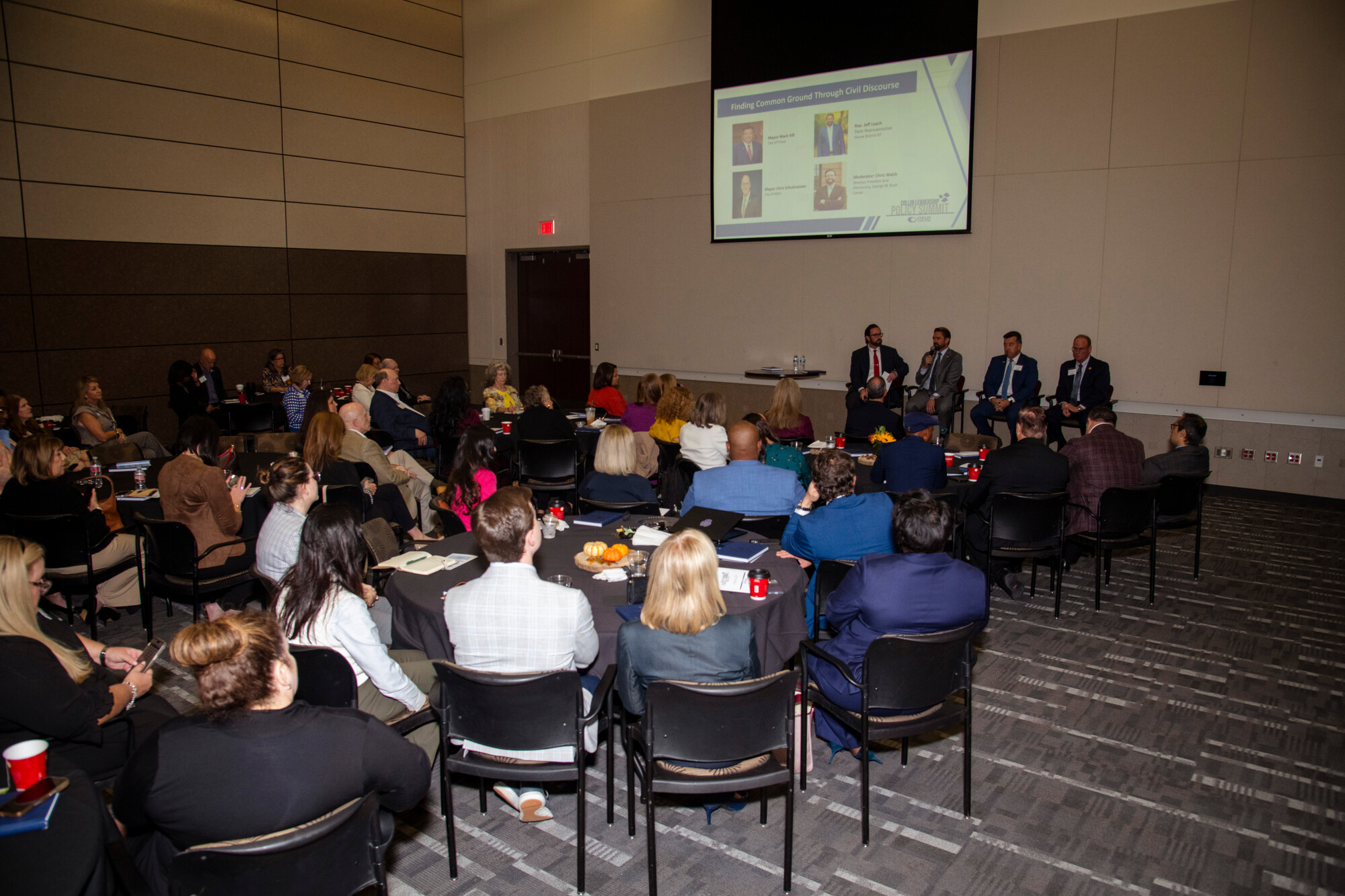 Room with panel discussion.