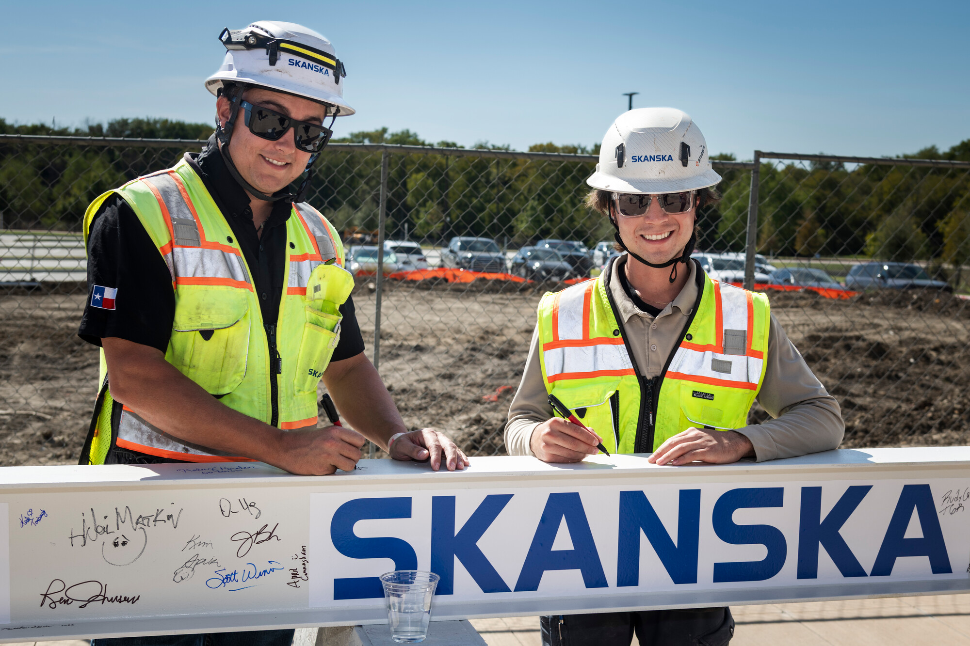construction men sign steel beam