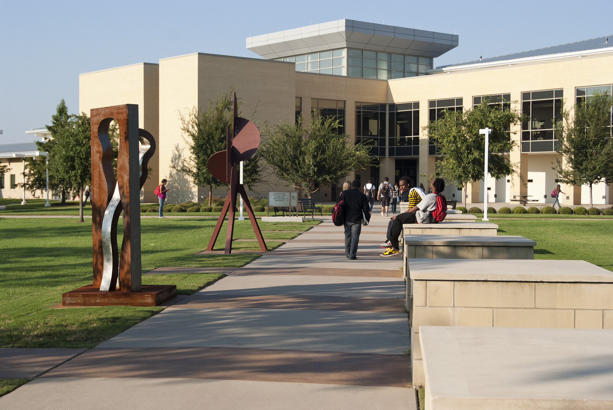 students walking toward college campus
