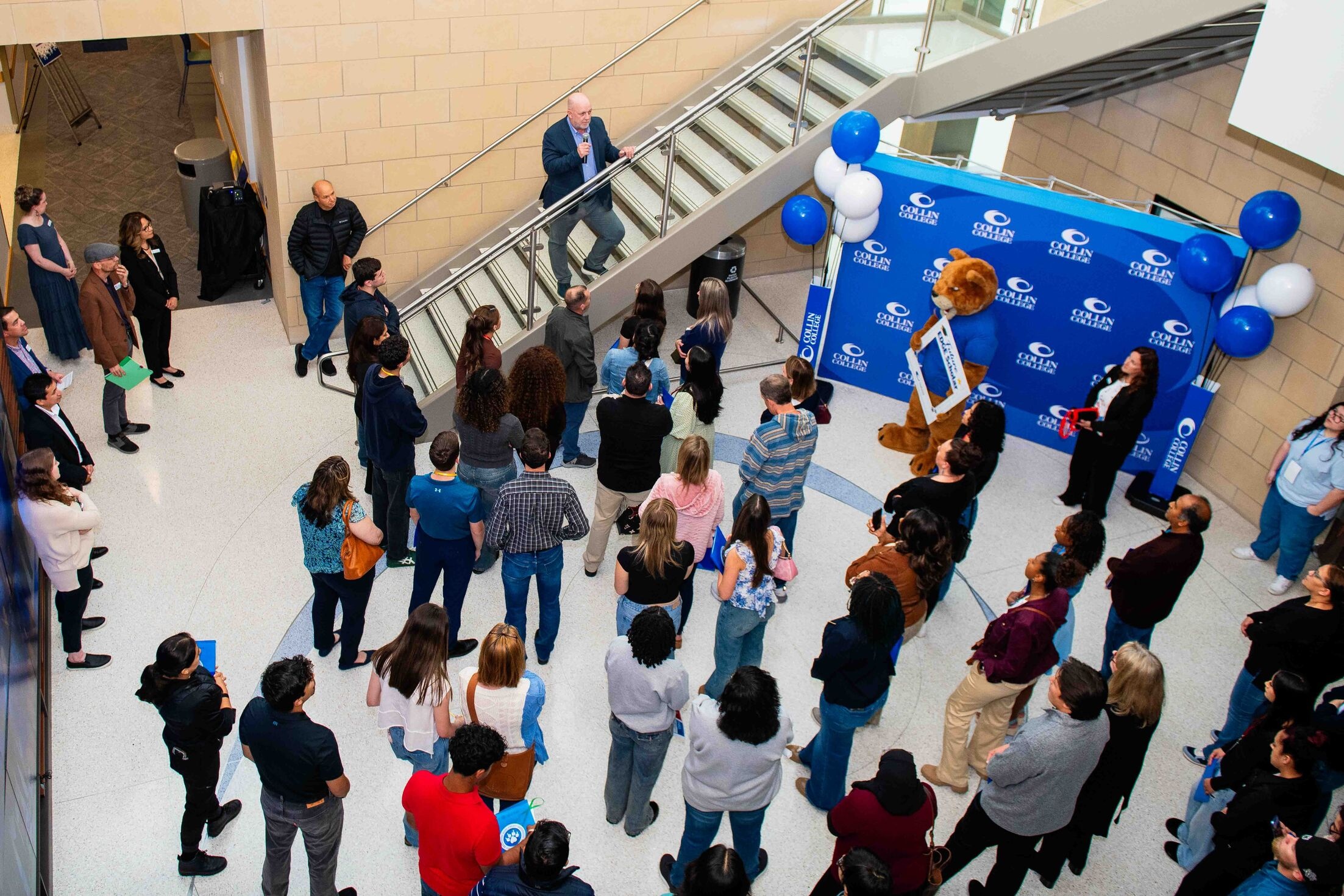 Group of people listening to speaker 